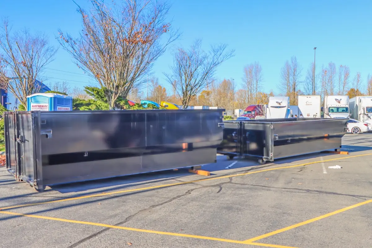 Professional dumpster rental service with roll-off container on residential driveway in Springtown